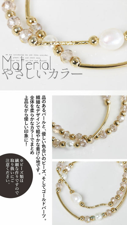 優しく愛らしく、手元で輝く二つのブレス。『ゴールド』